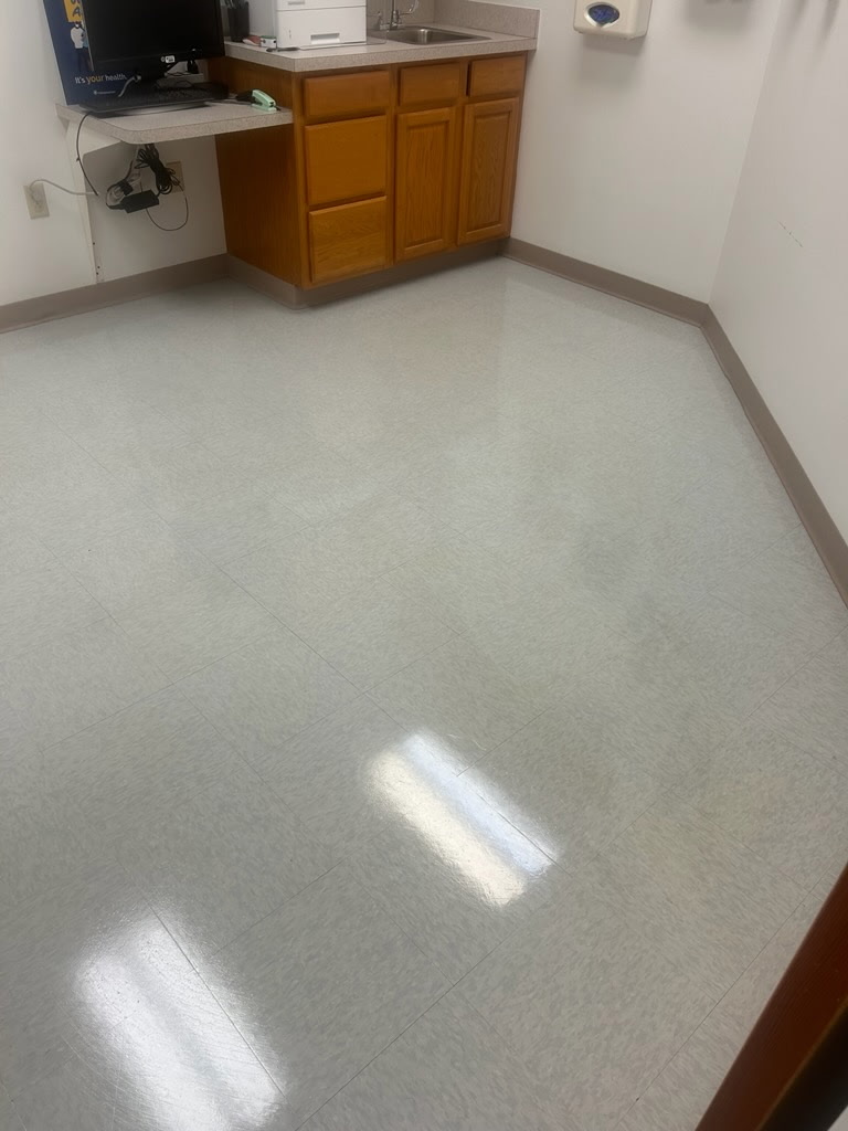 Same exam room floor after cleaning and refinishing