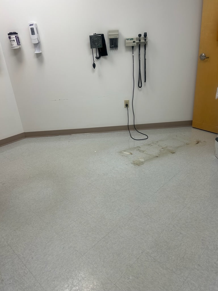Exam room floor before cleaning